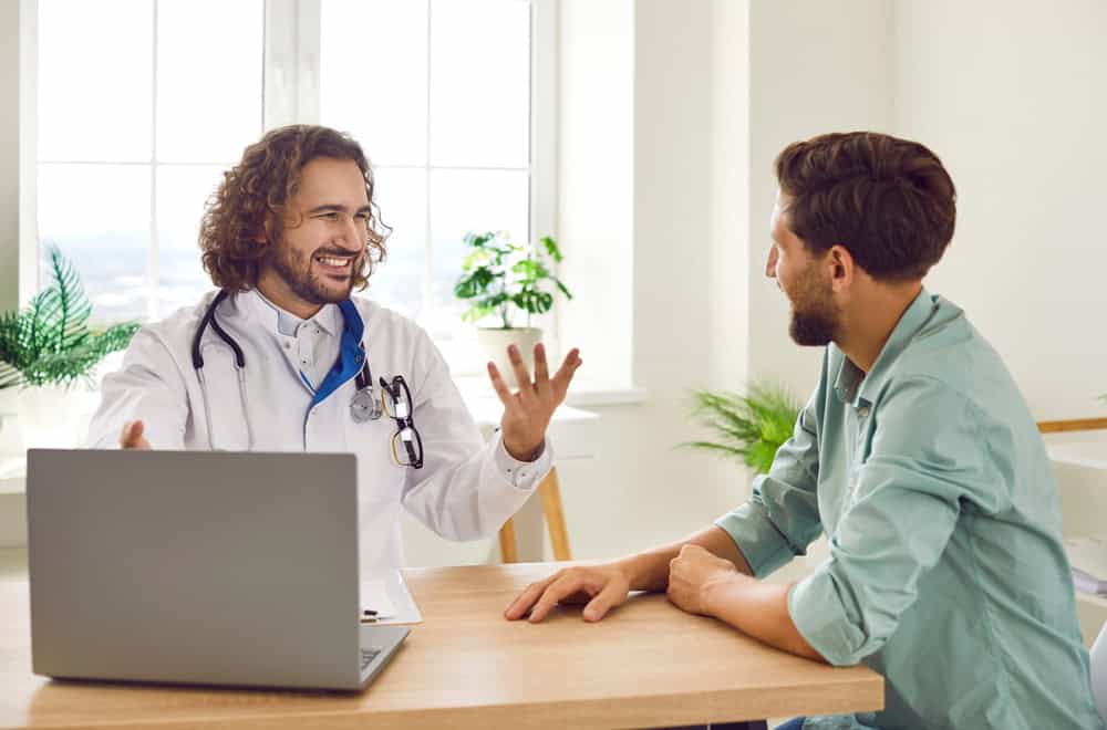 Portrait,Of,A,Happy,Smiling,Young,Man,Patient,In,Office