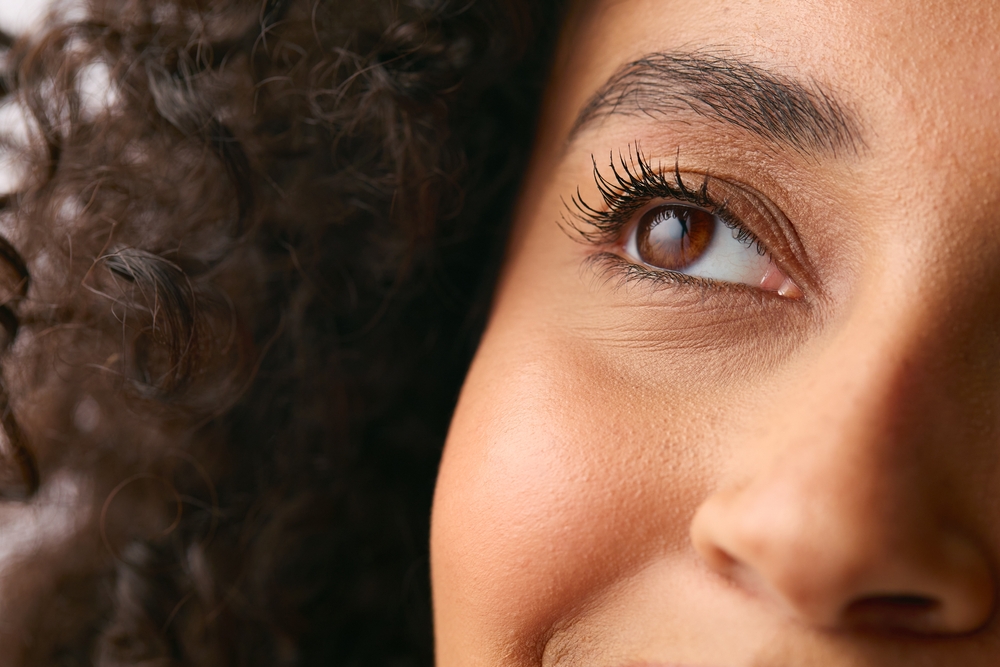 Close,Up,Studio,Portrait,Showing,Eye,Of,Smiling,Natural,Woman
